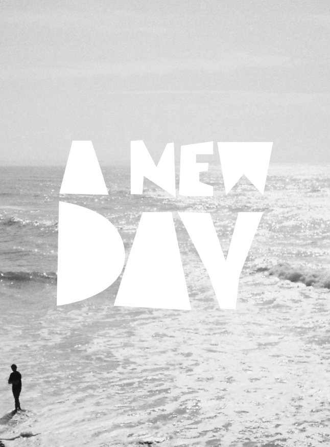 A black and white image of the sea with the A NEW DAY logo.